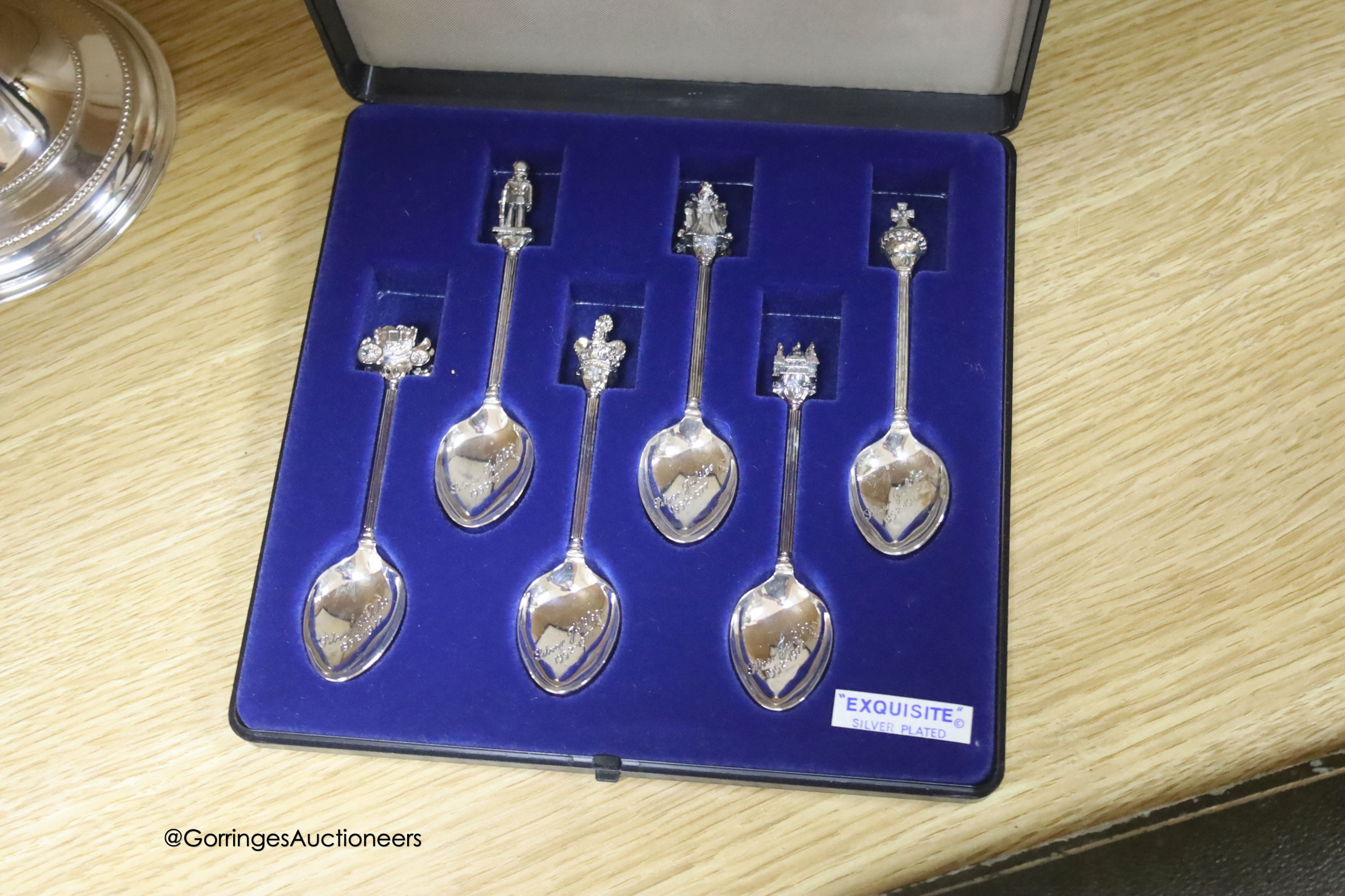 A group of plated ware including a pair of Georg Jensen salad servers